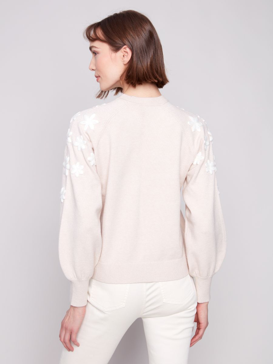 Chandail col rond fleurs bras