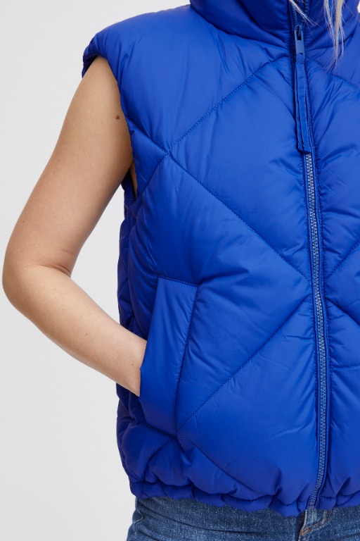 VESTE SANS MANCHES COURTE UNIE